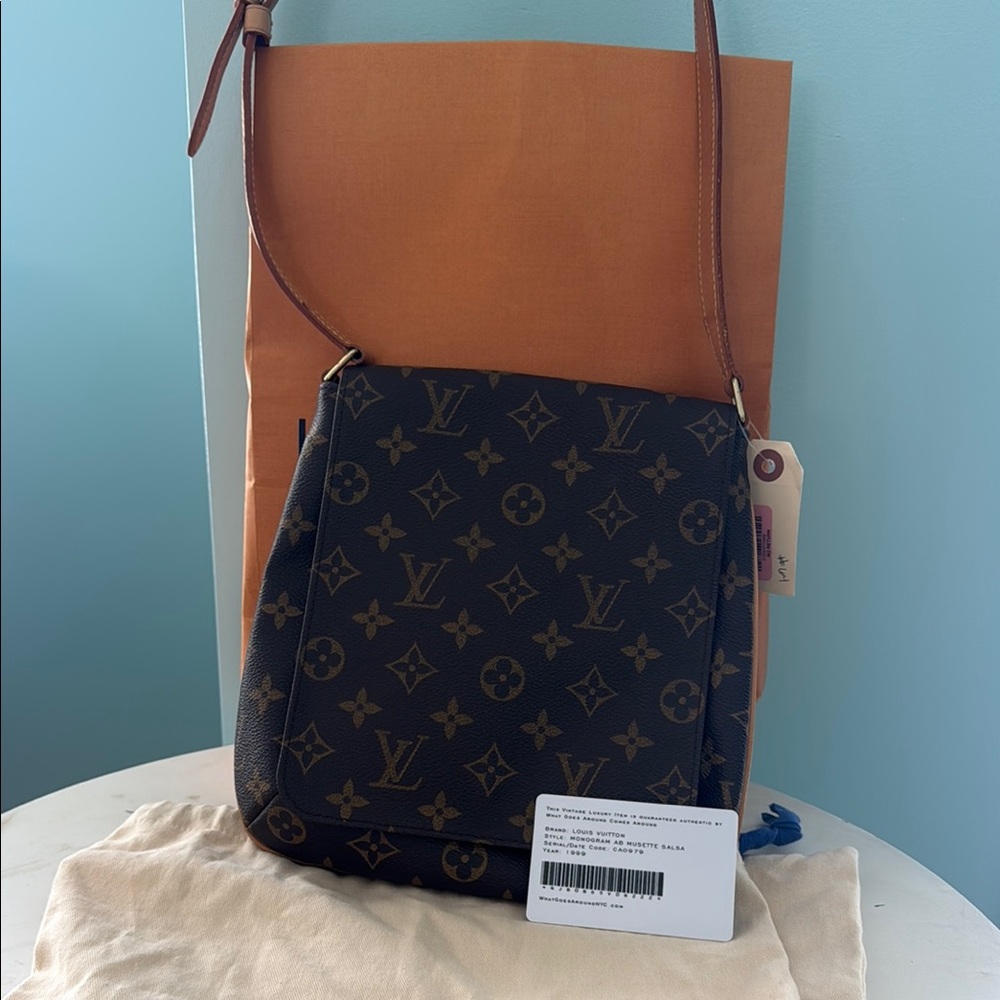 Louis Vuitton Brown Monogram Musette Salsa Bag with Tan Strap with dust bag.